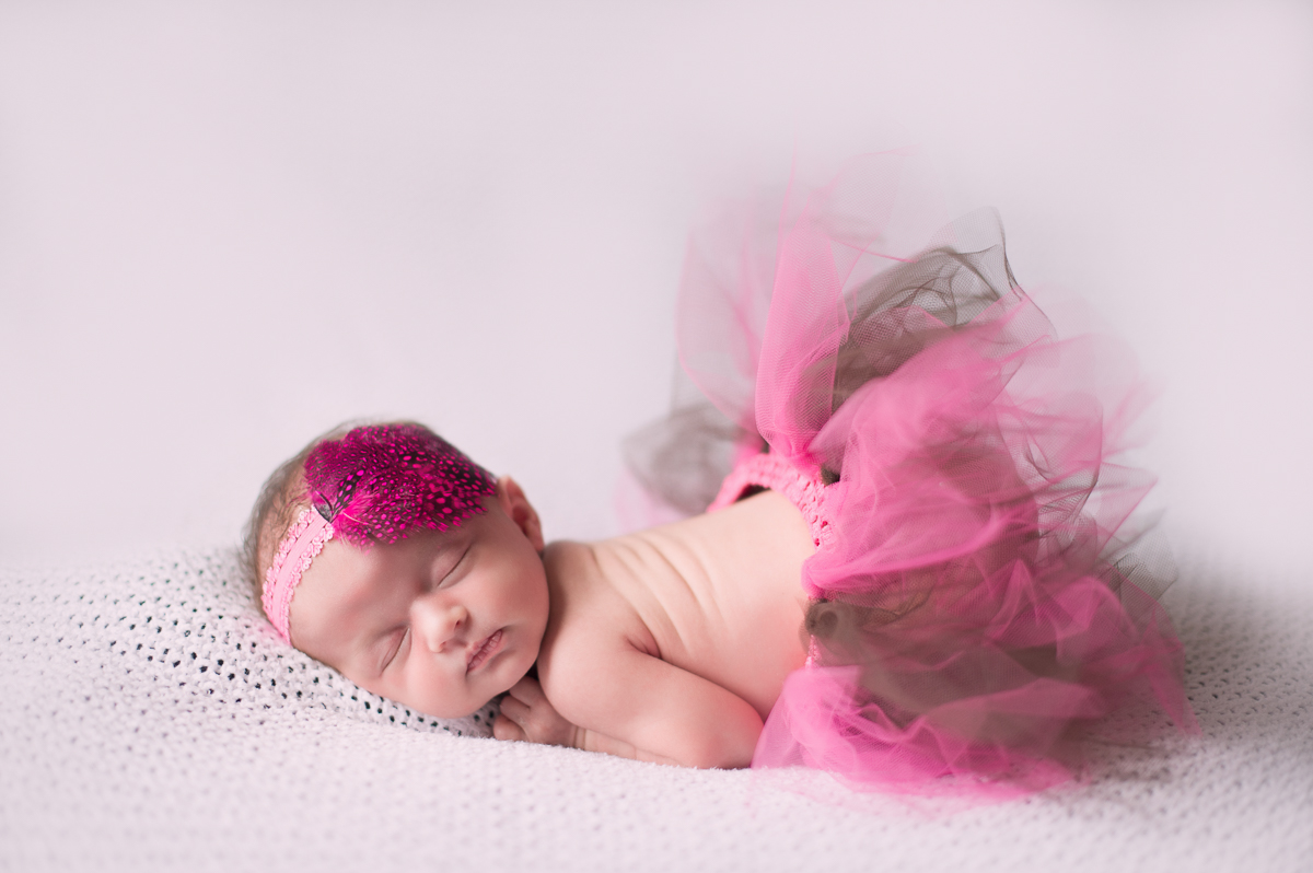 Baby girl wearing a tutu sleeping by Greenville SC Newborn Photographer Elizabeth and Charles.
